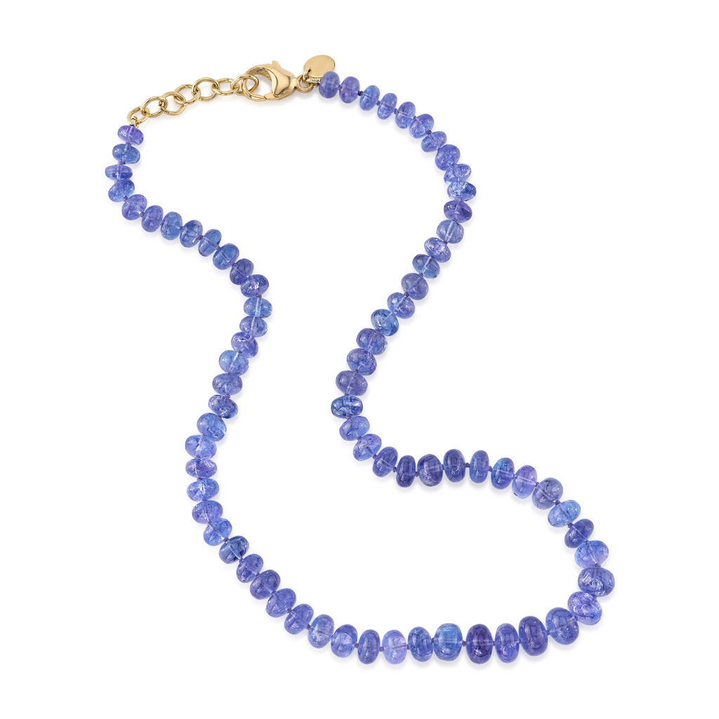 TANZANITE BEAD NECKLACE, 150 carats of polished tanzanite beads with an 18 karat yellow gold clasp and extender links. Necklace measures 16"., NECKLACES, Single Stone San Marino