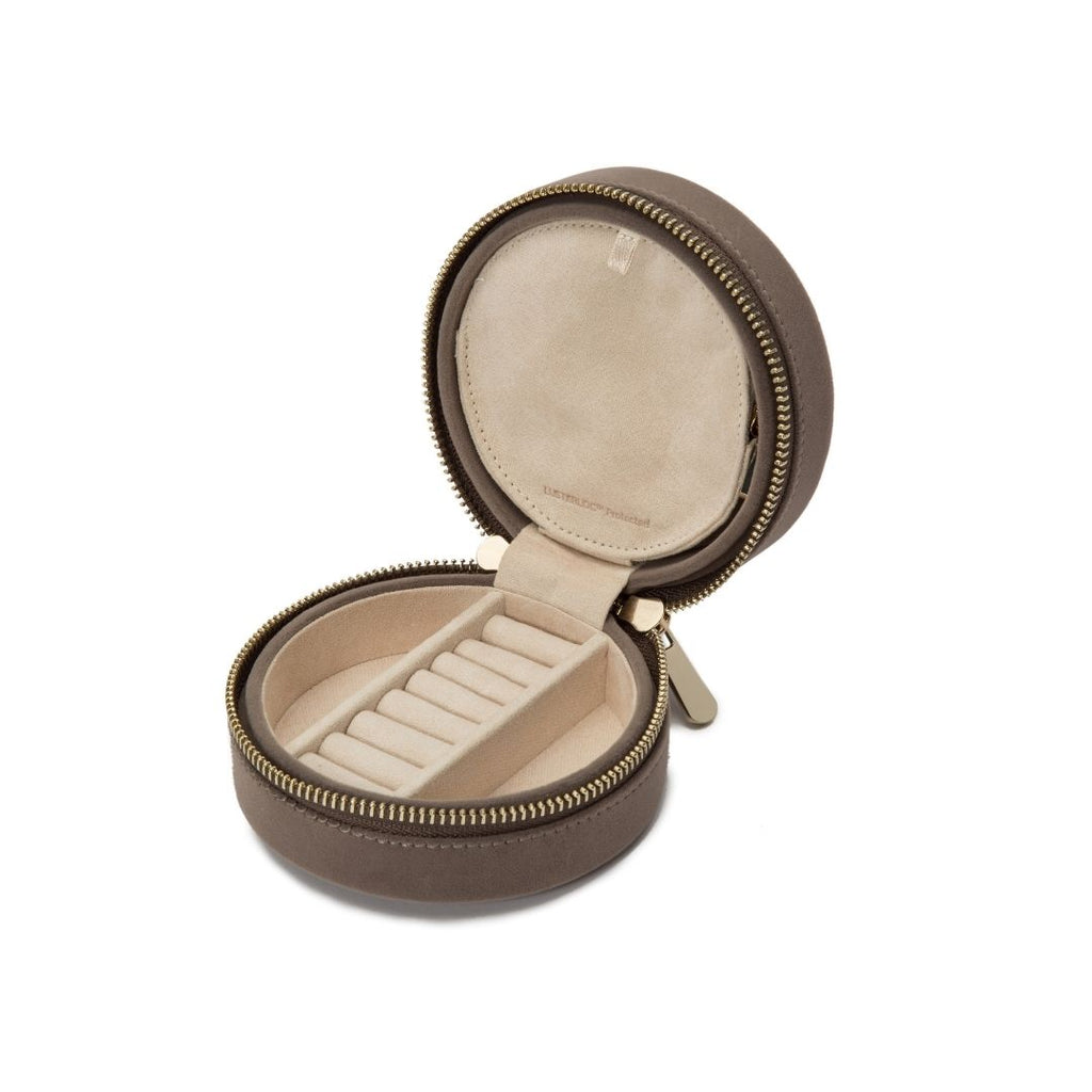 ZOE ROUND TRAVEL CASE, Mink velvet Mirror, 7 ring rolls, 2 compartments and a zip pouch LusterLoc™: Allows the fabric lining the inside of your jewelry cases to absorb the hostile gases known to cause tarnishing. Under typical storage conditions, it can p