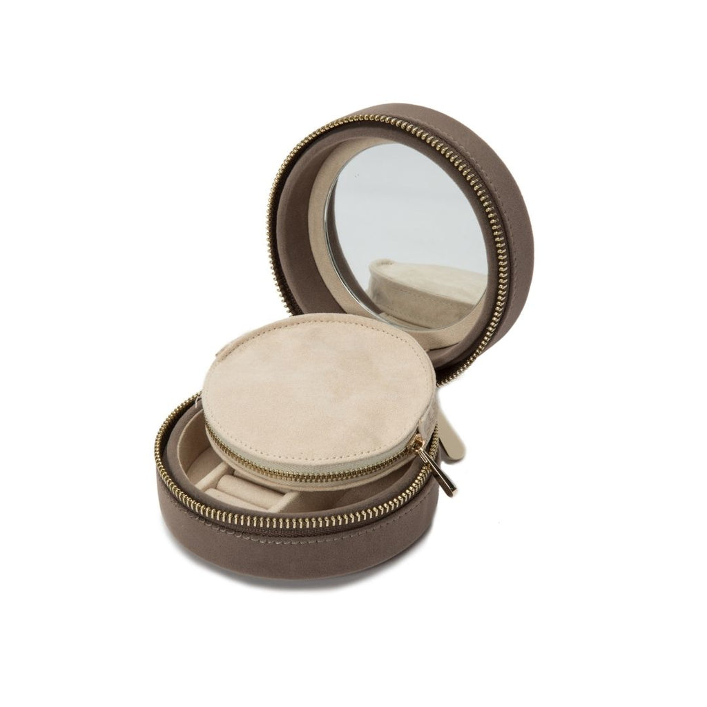 ZOE ROUND TRAVEL CASE, Mink velvet Mirror, 7 ring rolls, 2 compartments and a zip pouch LusterLoc™: Allows the fabric lining the inside of your jewelry cases to absorb the hostile gases known to cause tarnishing. Under typical storage conditions, it can p