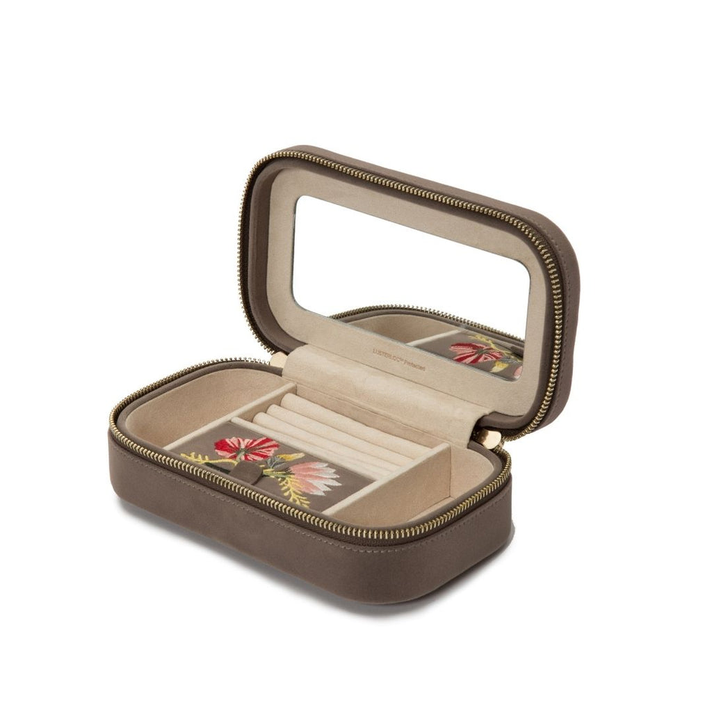 ZOE TRAVEL ZIP CASE, Mink velvet Mirror, 3 ring rolls, medium compartment with cover, and 2 small compartments LusterLoc™: Allows the fabric lining the inside of your jewelry cases to absorb the hostile gases known to cause tarnishing. Under typical stora